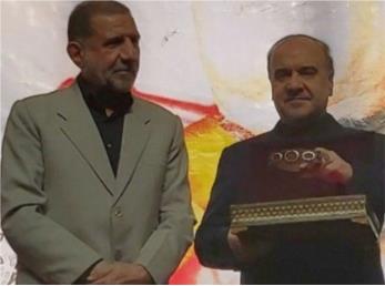 اهدای بازوبند پهلوان ملی به خانواده شهید قاسم سلیمانی